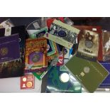 A bag of coin packs and coin sets includes IOM 2013 year set,