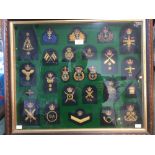 A framed display of post war Royal Navy Officers and Petty Officers and WRENS bullion wire hand