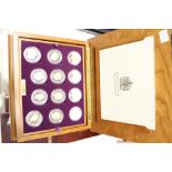 Queen Elizabeth II "Golden Jubilee Collection" 24 silver proof Crown sized coins in original wooden