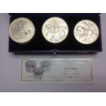 The Royal Mint 'St George and the Dragon' set of three silver boxes,