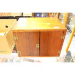 A Coin Cabinet in Mahogany with Plywood Shelves.