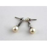 ***REOFFER HANSONS DERBY APRIL £60/£80***  A pair of white metal, diamond and pearl drop earrings,