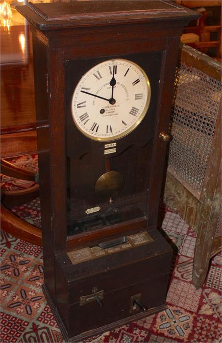 The Gledhill Brook Time Recorders, work place Clocking in Clock. Model number 17853. 110x40x28cms.