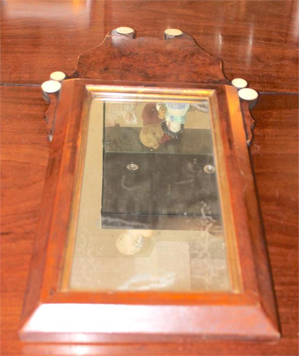 Dutch walnut , cushion wall mirror with original glass. 72 x 35 cms. Together with a Victorian