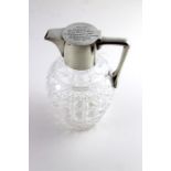 A silver mounted claret jug, by Hukin & Heath, Birmingham 1906, base of hob nail cut glass.