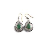 A pair of emerald and diamond drop earrings, of teardrop form set large pendeloque cut emerald in