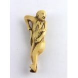 A Japanese Edo period ivory netsuke of gentleman bather toweling himself, 18th century, carved