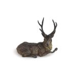 A 19th century cold painted bronze model of a stag marked Geschutz and an indistinct mark,