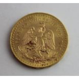 A 1947 Mexican 50 Pesos 1.2 troy ounce gold coin, .900 purity, being a re-strike of the 1921 coin.