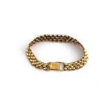 An 18ct gold bracelet, having links formed of faceted lozenges, (one plain link lacking to verso),