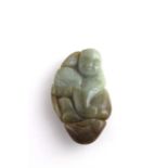 ***AWAY - LONDON*** A Chinese carved Jade pebble depicting a sage holding a vessel. 7.5cms
