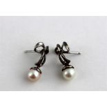 ***REOFFER HANSONS DERBY APRIL £60/£80***  A pair of white metal and pearl drop earrings,