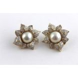 ***REOFFER HANSONS DERBY APRIL £600/£800***  A pair of pearl and diamond cluster 18ct. gold flower