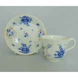 A good Worcester Coffee cup & Saucer of faceted form. Painted with 'Dry blue' flowers and gilt