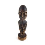 ***REOFFER HANSONS DERBY APRIL £40/£60***  An African tribal carved wood figure, late 19th/early