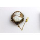 A 19th century cameo, of a classical maiden in profile, set within gilded mount. Height 5 cm.