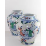 A pair of large Chinese Wucai vases, probably 19th century, decorated in transitional style, of