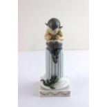 Royal Copenhagen fig 433 Fawn playing pipes seated on a column with a lizard. 21cms high. Very