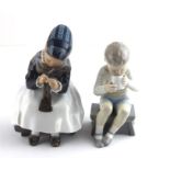 Copenhagen porcelain model of a girl with clogs 1314 together with Copenhagen Denmark model of a boy