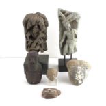 Two 19th century Indian stone fragments and a collection of carved heads. Six items in total.