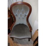 An early 20th century walnut salon chair
