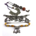 ***REOFFER HANSONS DERBY APRIL £100/£150***  An Islamic white metal and amber type bead necklace,