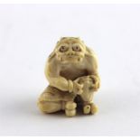 A Japanese Meiji period ivory netsuke/small okimono, late 19th/early 20th century, fashioned as a