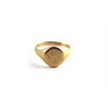 An 18ct. gold oval signet ring, London 1935, engraved owners initials. (9.1 grams)