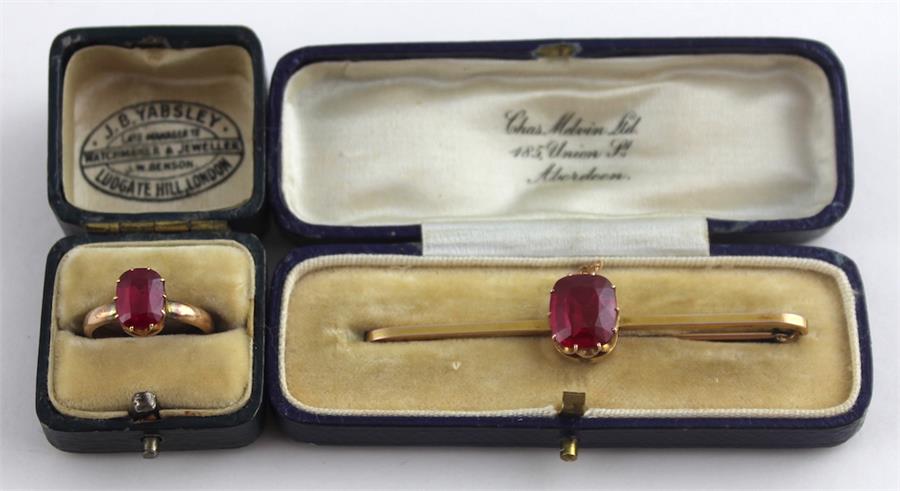A synthetic ruby and yellow metal bar brooch and a similar matching ring, (both assessed as - Image 2 of 6
