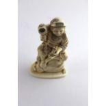 ***REOFFER HANSONS DERBY APRIL £100/£200*** A Japanese Meiji period carved Ivory okimono of a seated