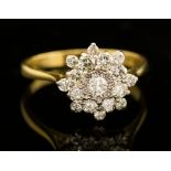 A diamond flower head cluster yellow gold ring,