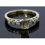 A diamond solitaire Millennium cut 18ct white gold ring with diamond set shoulders,
