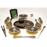 A George V comprehensive tortoiseshell and silver dressing table set,