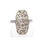 An Art Deco diamond set platinum ring, the oval geometric design head,