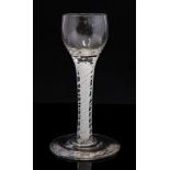 An 18th century opaque twist wine glass, the ovoid bowl on a double spiral and lattice core,