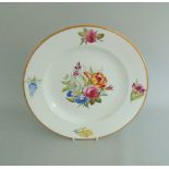 A Derby botanical plate decorated with a floral spray to the centre and four single sprays to the