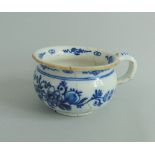 A Dutch Delft small chamber pot, decorated with floral sprays in under glaze blue, circa 1760,