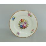 A Derby botanical plate decorated with a floral spray to the centre and four single sprays to the