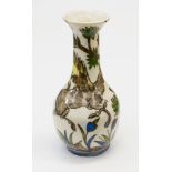 A Persian bottle vase, painted with a Lion hunting a Deer, bottle form, in the Iznik style,