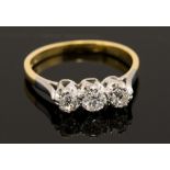 A diamond three stone ring, three round brilliant cut diamonds, a total diamond weight of approx 0.