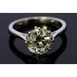 A diamond solitaire platinum ring, the round old cut diamond weighing approximately 4.