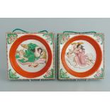 A pair of Staffordshire pottery wall plaques, brightly decorated, depicting 'Night & Day',