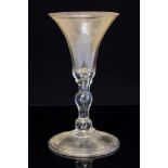 An 18th century wine glass,