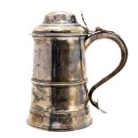 An 18th Century silver lidded tankard with dome top,