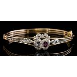 A diamond and ruby sweetheart bangle, circa 1900,