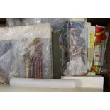 A box containing parts of a model toy theatre, scenery, backdrops, figures,