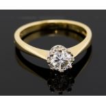 A diamond solitaire ring, the round brilliant cut diamond weighing approx 0.