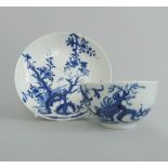 A Worcester blue and white tea bowl and saucer, decorated with 'The Prunus Root' pattern,