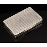An Edwardian silver snuff box, the cover and body with striated pattern between Greek key border,