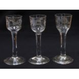 Three 18th Century wine glasses, the ogee bowls etched with hunting scenes and birds with foliage,